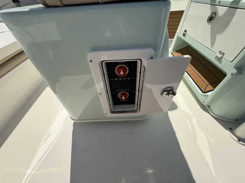 Slide: The Image of 2024 Pathfinder 2600 TRS boat control panel with open access door. - 47