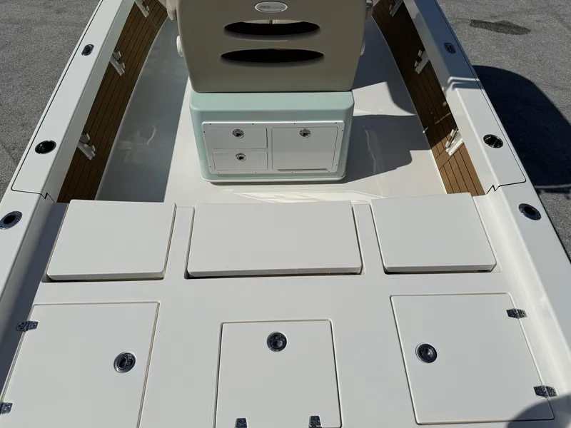 Slide: The Image of 2024 Pathfinder 2600 TRS boat interior with storage compartments and seating. - 7