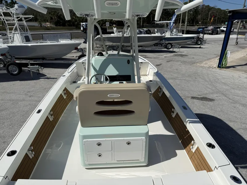 Slide: The Image of 2024 Pathfinder 2600 TRS boat, interior view, showcasing helm and seating area. - 8