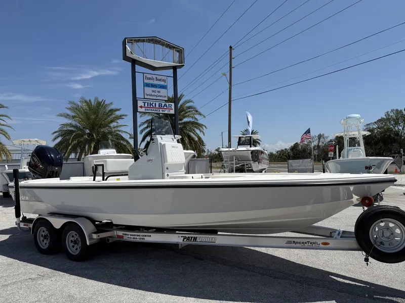 Slide: The Image of 2024 Pathfinder 2300 HPS boat on trailer at Family Boating Center. - 1