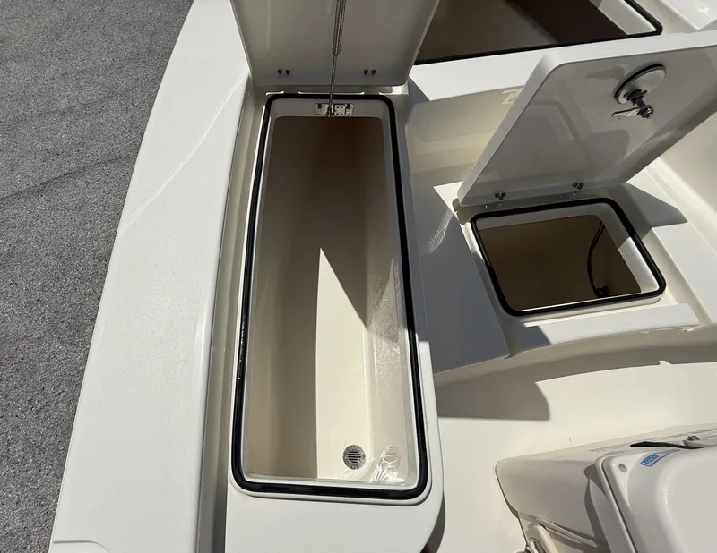 Slide: The Image of 2024 Pathfinder 2300 HPS boat storage compartments open, showcasing spacious interior design. - 30