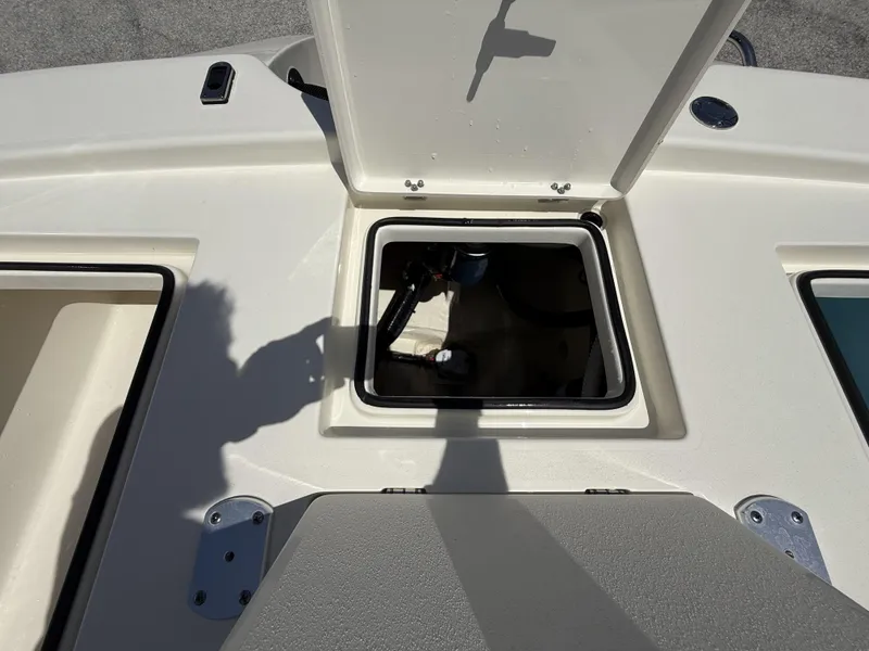 Slide: The Image of 2024 Pathfinder 2300 HPS boat hatch open, revealing storage compartment. - 39