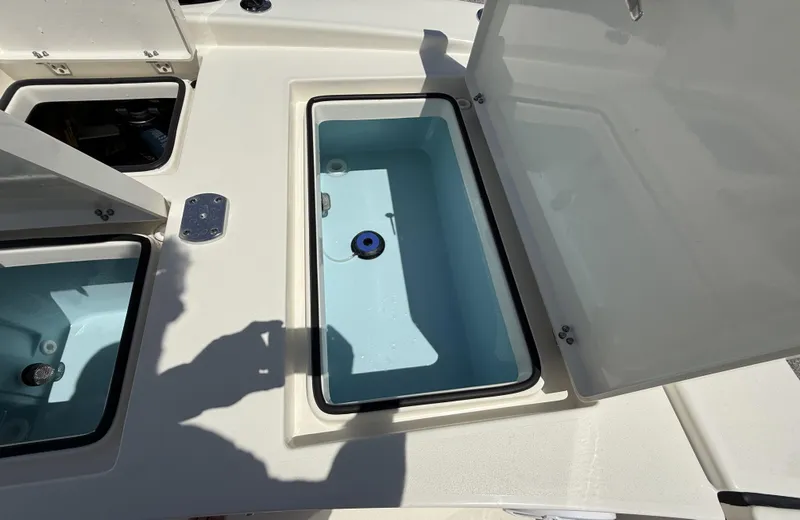 Slide: The Image of Open storage compartment on 2024 Pathfinder 2300 HPS boat, showcasing interior design. - 40