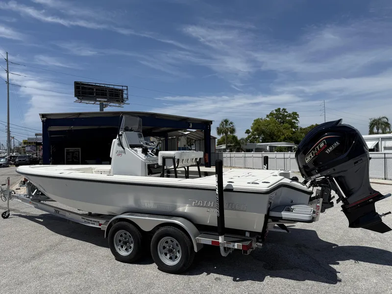 Slide: The Image of 2024 Pathfinder 2300 HPS boat on trailer with Yamaha engine, parked outdoors. - 5