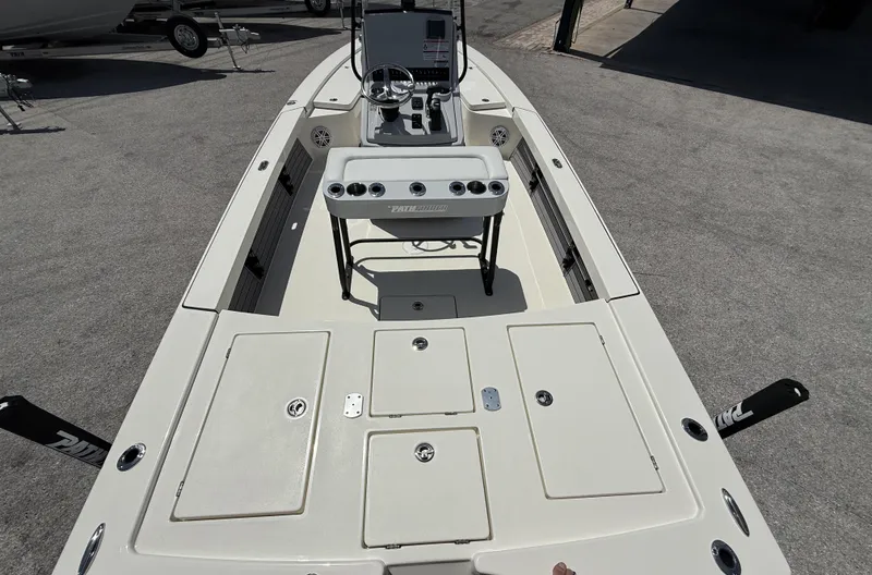 Slide: The Image of 2024 Pathfinder 2300 HPS boat interior with storage compartments and control console. - 8