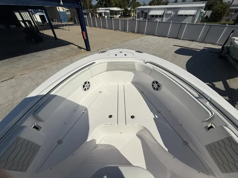 Slide: The Image of 2024 Aquasport 2300 CC boat interior with spacious seating and modern design. - 29