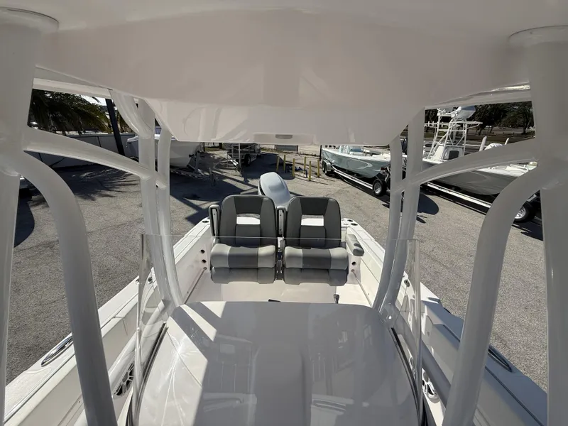 Slide: The Image of 2024 Aquasport 2300 CC boat interior with dual seating and sleek design. - 31