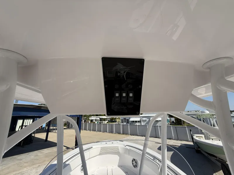 Slide: The Image of 2024 Aquasport 2300 CC boat console with overhead view and control panel. - 7