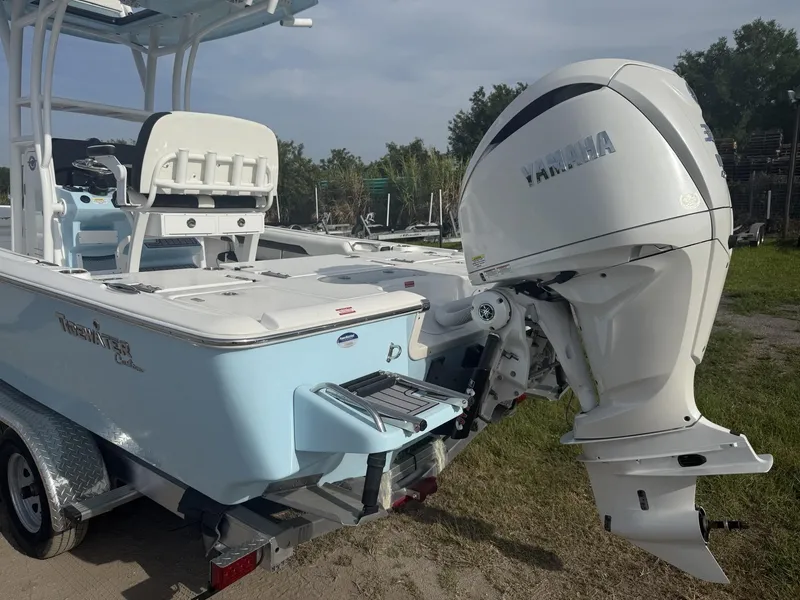 Slide: The Image of 2024 Tidewater 2500 Carolina Bay boat with Yamaha engine, parked on a trailer. - 34