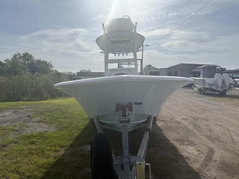Slide: The Image of 2024 Tidewater 2500 Carolina Bay boat on trailer under sunny sky. - 35