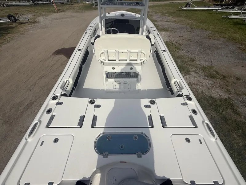 Slide: The Image of 2024 Tidewater 2500 Carolina Bay boat interior with seating and storage compartments. - 37