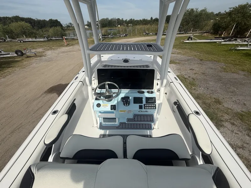 Slide: The Image of 2024 Tidewater 2500 Carolina Bay boat interior with steering console and seating. - 39