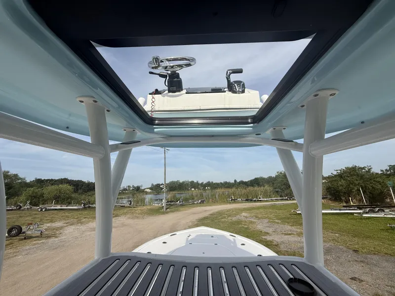 Slide: The Image of 2024 Tidewater 2500 Carolina Bay boat interior view with steering console. - 41