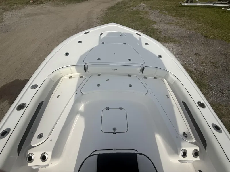 Slide: The Image of 2024 Tidewater 2500 Carolina Bay boat deck, featuring spacious seating and storage compartments. - 42