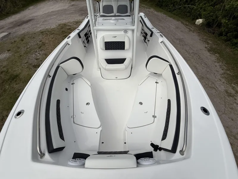 Slide: The Image of 2024 Tidewater 220 CC Adventure boat interior with spacious seating and storage compartments. - 13