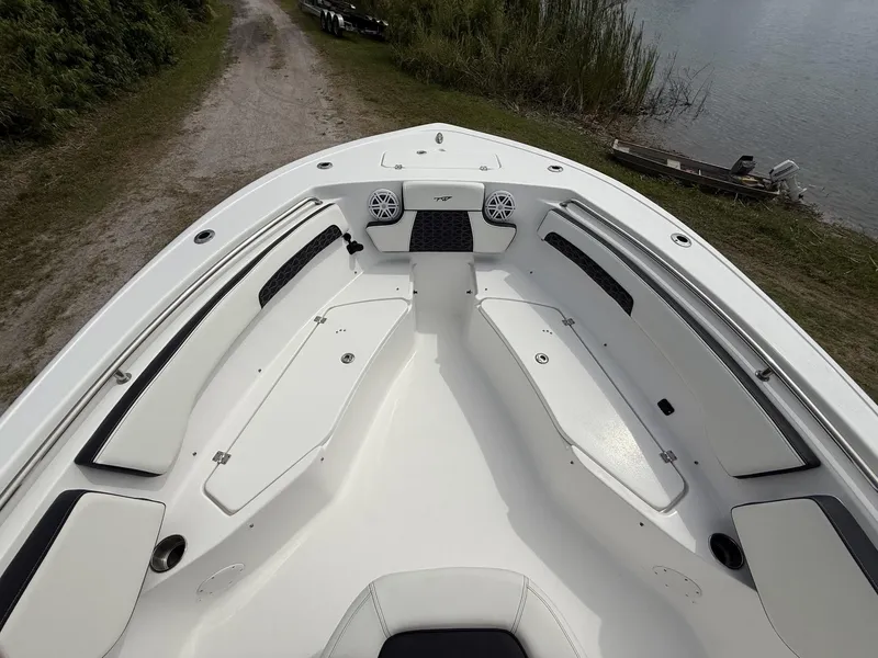 Slide: The Image of 2024 Tidewater 220 CC Adventure boat interior with seating and storage compartments. - 24