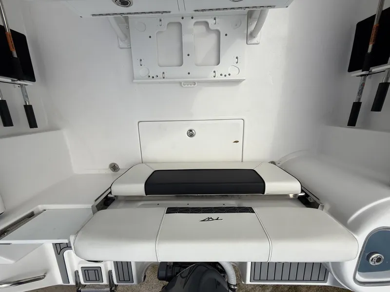 Slide: The Image of 2024 Tidewater 220 CC Adventure boat interior with foldable seating and storage compartments. - 30