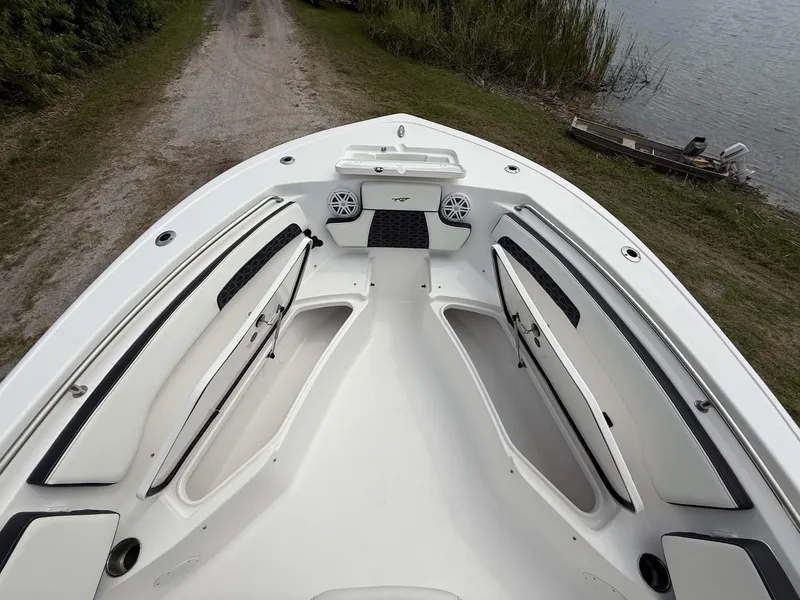 Slide: The Image of 2024 Tidewater 220 CC Adventure boat interior with seating and storage compartments. - 33