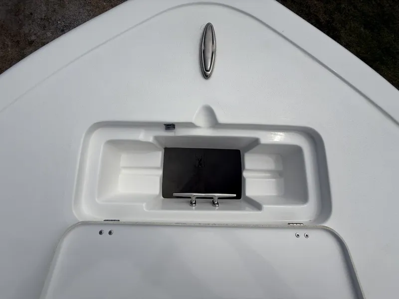 Slide: The Image of 2024 Tidewater 220 CC Adventure boat deck with storage compartment and cleat. - 35