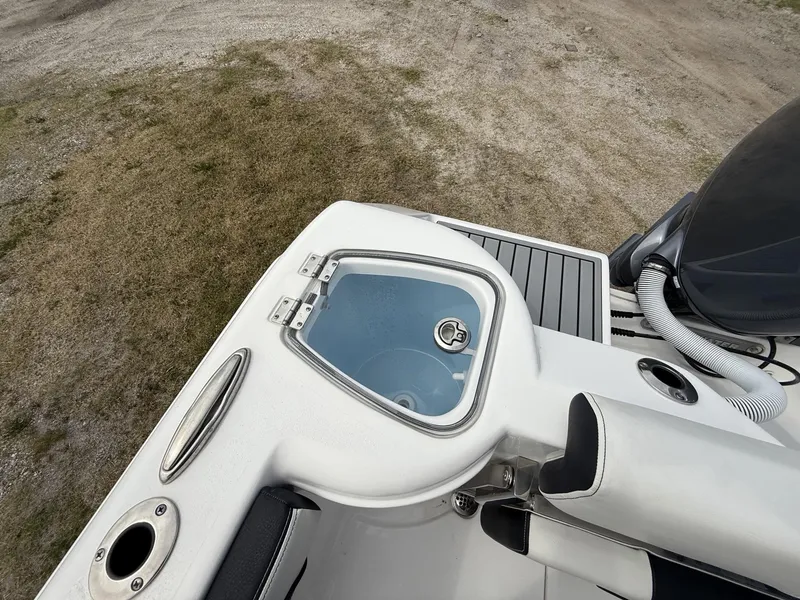 Slide: The Image of 2024 Tidewater 220 CC Adventure boat deck with livewell and seating. - 9