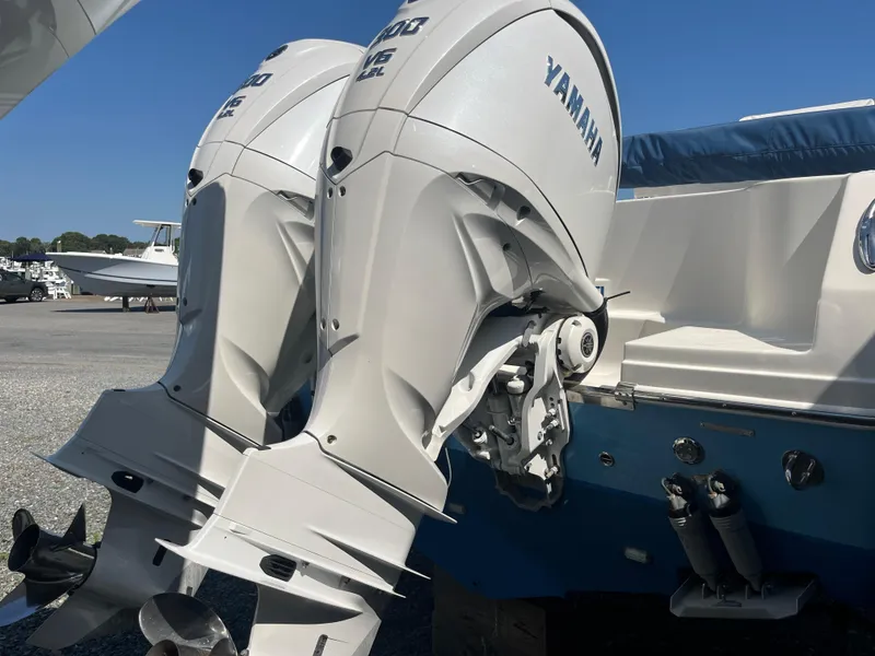 Slide: The Image of 2022 Sailfish 320 CC with twin Yamaha outboard engines. - 13