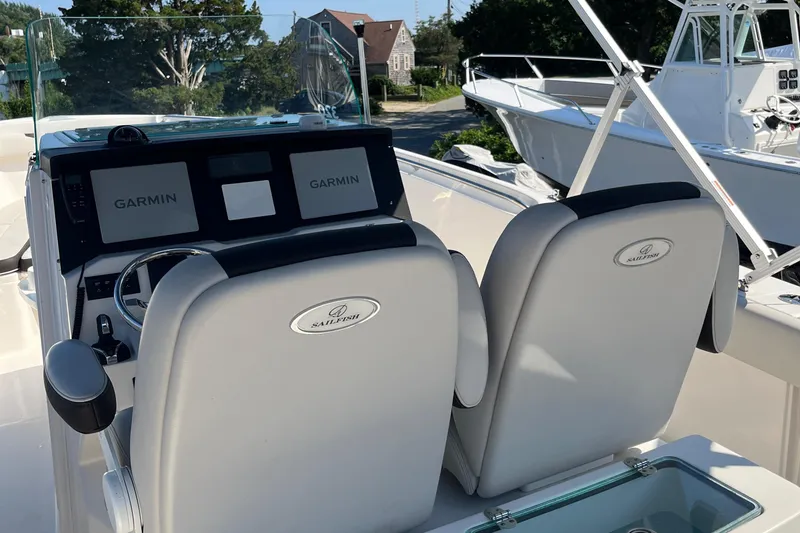 Slide: The Image of 2022 Sailfish 320 CC boat cockpit with Garmin navigation system. - 14