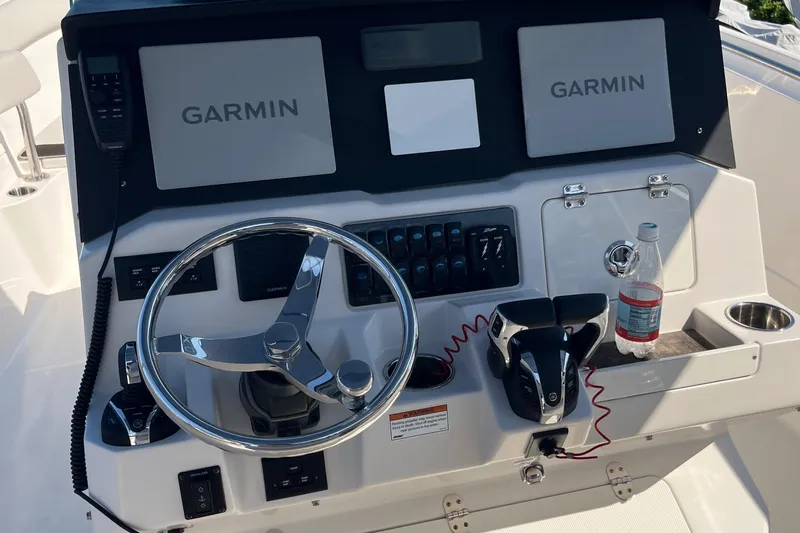 Slide: The Image of Control panel of a 2022 Sailfish 320 CC boat with Garmin displays. - 15