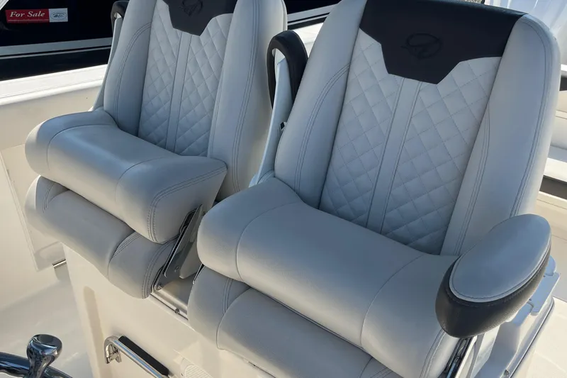 Slide: The Image of 2022 Sailfish 320 CC boat with luxurious dual captain's chairs. - 17