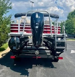 Slide: The Image of 2024 Ranger Reata 220F pontoon boat with powerful outboard motor. - 5