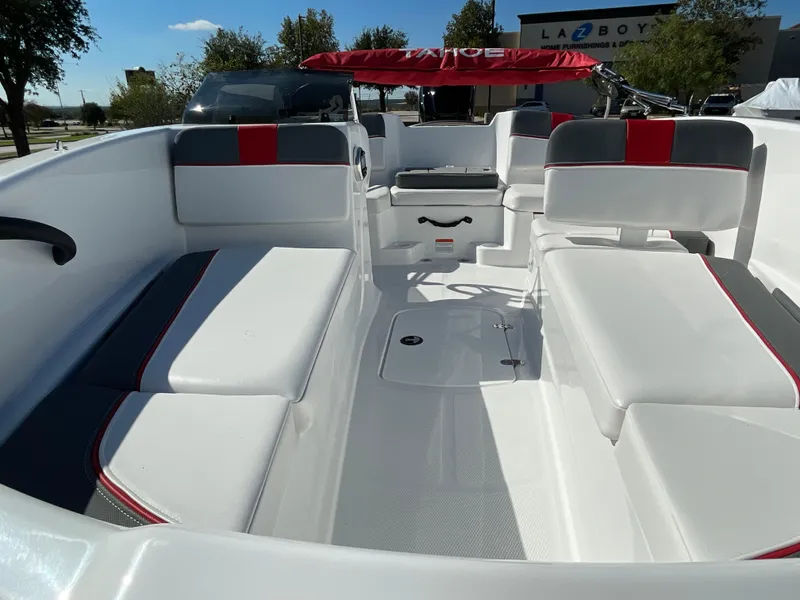Slide: The Image of 2024 Tahoe T16 boat interior with white and red seating, spacious layout, and modern design. - 11