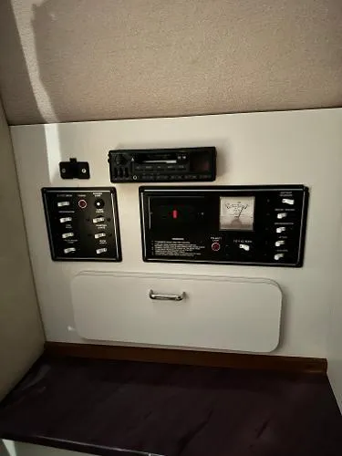 Slide: The Image of 1994 Crownline 250 CR control panel with switches and stereo system. - 18