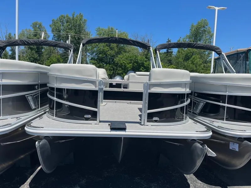 Slide: The Image of 2024 SunChaser Vista Fish 20 pontoon boat on display, front view. - 2