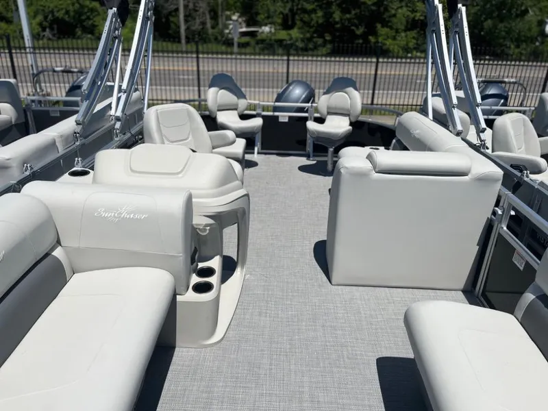 Slide: The Image of 2024 SunChaser Vista Fish 20 pontoon boat interior with plush seating and cup holders. - 4