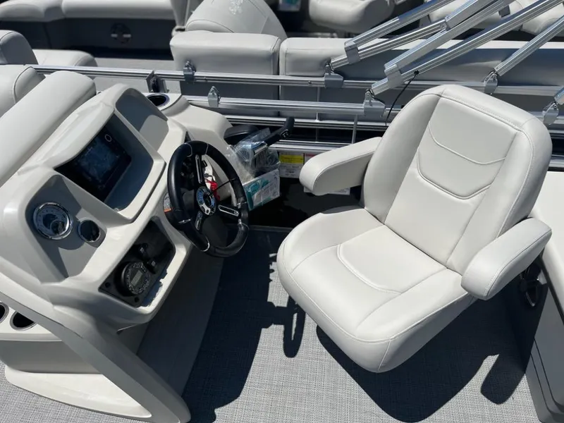 Slide: The Image of 2024 SunChaser Vista Fish 20 boat interior with captain's chair and control console. - 7