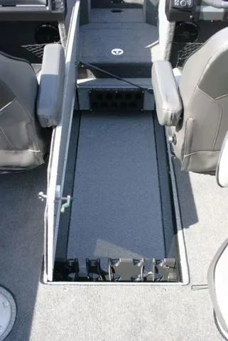 Slide: The Image of 2024 Lund 1975 Tyee Sport boat interior with storage compartment and seating. - 13