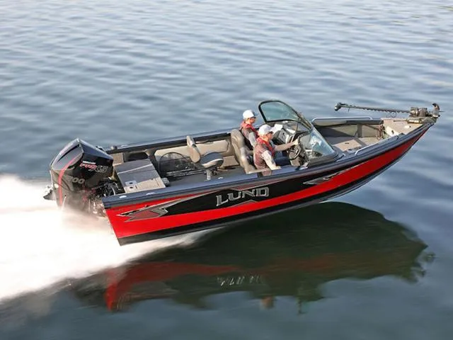 Slide: The Image of 2024 Lund 1975 Tyee Sport boat cruising on water. - 15