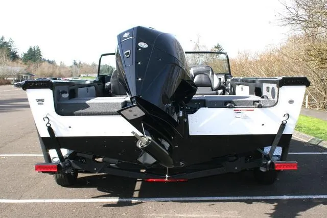 Slide: The Image of 2024 Lund 1975 Tyee Sport boat rear view with outboard motor. - 4