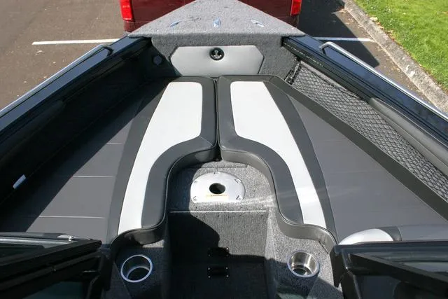 Slide: The Image of 2024 Lund 1975 Tyee Sport boat interior with cushioned seating and cup holders. - 9