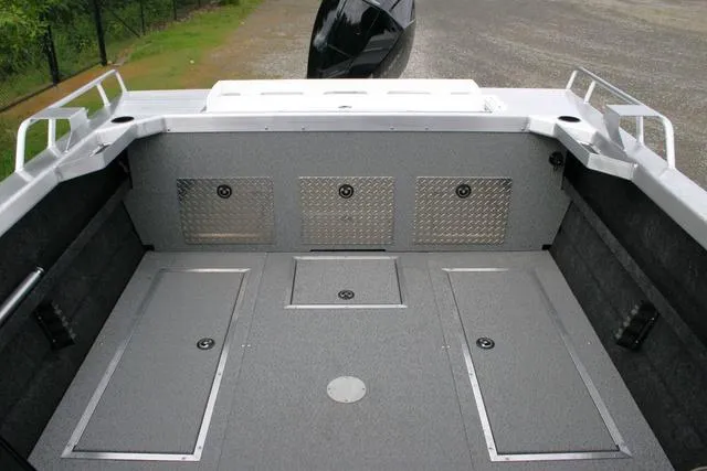 Slide: The Image of 2024 Thunder Jet 210 Luxor Limited boat interior with storage compartments. - 10