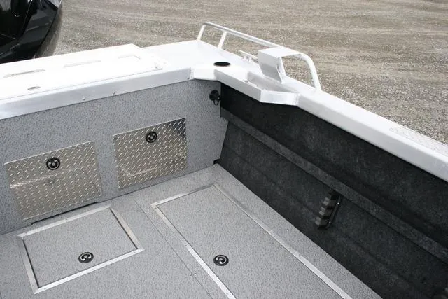 Slide: The Image of 2024 Thunder Jet 210 Luxor Limited boat interior with storage compartments. - 11