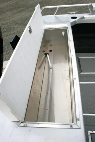 Slide: The Image of 2024 Thunder Jet 210 Luxor Limited boat storage compartment open. - 13