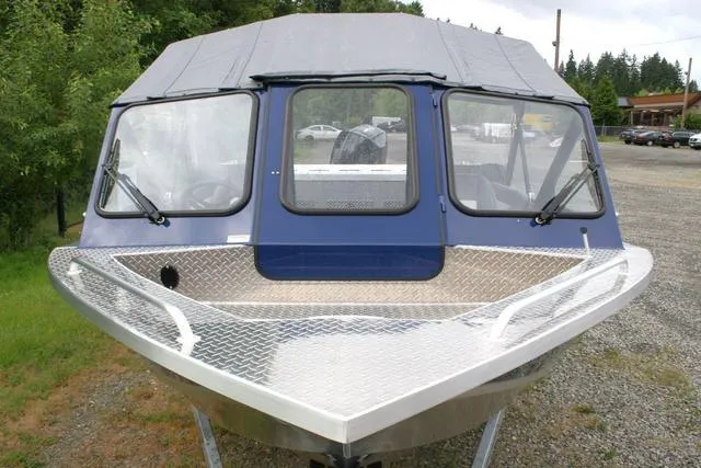 Slide: The Image of 2024 Thunder Jet 210 Luxor Limited boat front view with windshield and canopy. - 14