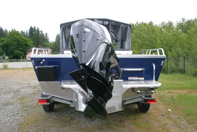 Slide: The Image of 2024 Thunder Jet 210 Luxor Limited boat rear view with outboard motor. - 4