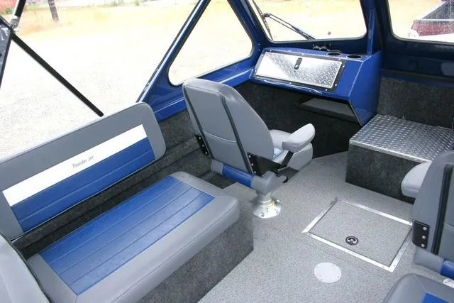 Slide: The Image of Interior of 2024 Thunder Jet 210 Luxor Limited boat with blue and gray seating. - 7