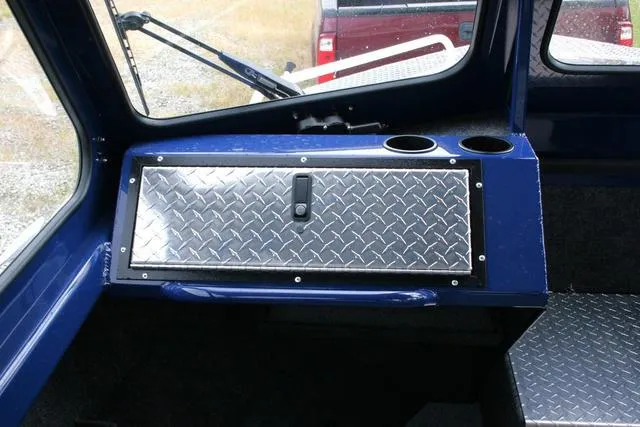 Slide: The Image of Interior of 2024 Thunder Jet 210 Luxor Limited boat with diamond plate storage compartment. - 9