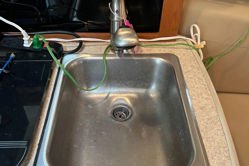 Slide: The Image of Stainless steel sink in 2007 Maxum 2400 SE boat kitchen area. - 21