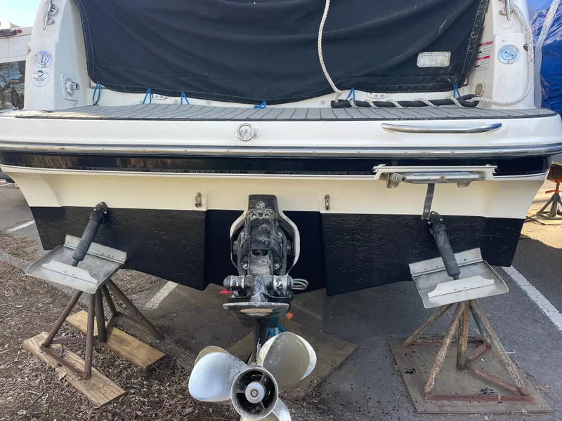 Slide: The Image of 2007 Maxum 2400 SE boat on stands, rear view showing propeller and outdrive. - 5