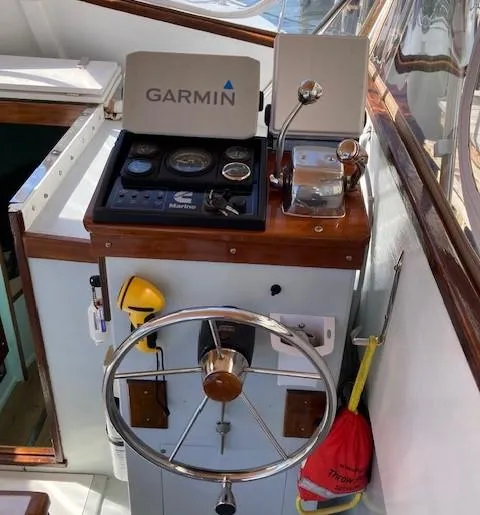 Slide: The Image of Helm of a 1968 Dyer 29 Bass Boat with Garmin navigation. - 12