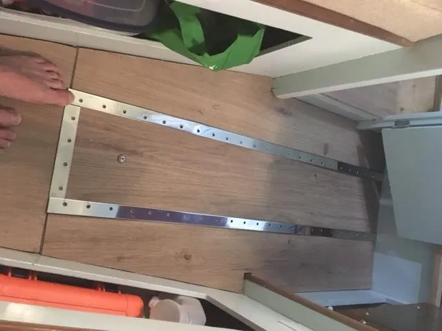 Slide: The Image of Interior of a 1968 Dyer 29 Bass Boat with wooden flooring. - 17