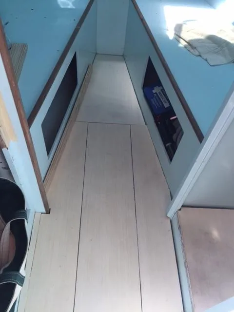 Slide: The Image of Interior of a 1968 Dyer 29 Bass Boat with wooden flooring. - 18